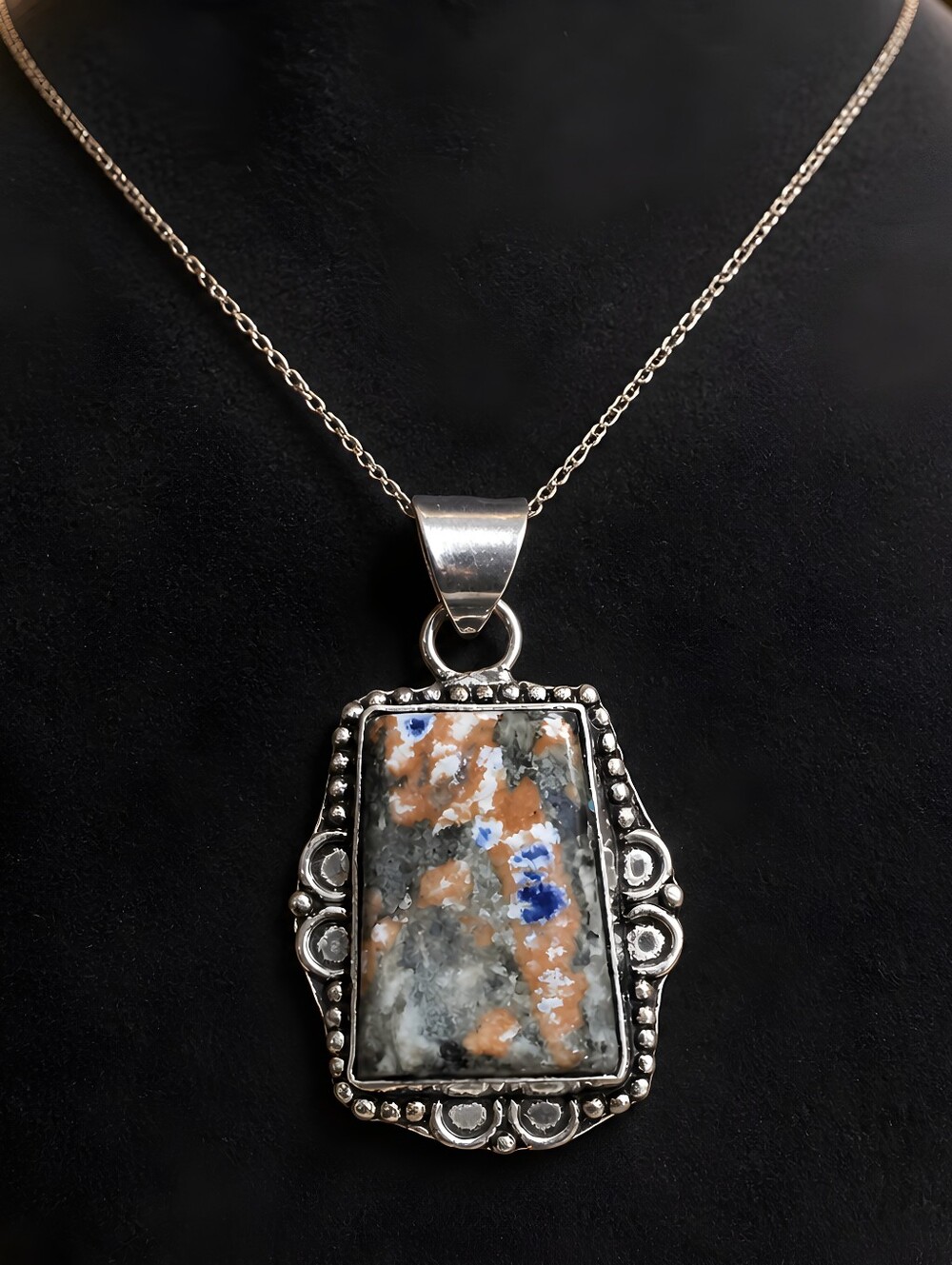 Made In 2010. Pendant is Orange Sodalite (also commonly sold as Sunset Sodalite)
